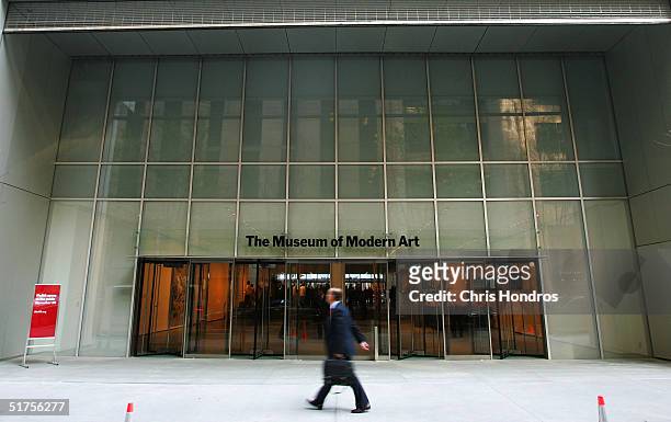 Pedestrian walks outside the entrance to the new Museum of Modern Art building on 53rd Street November 17, 2004 in New York City. The new Yoshio...