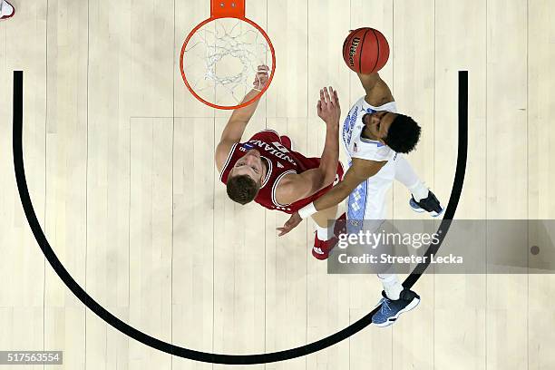 Joel Berry II of the North Carolina Tar Heels heads for the net as Max Bielfeldt of the Indiana Hoosiers defends during the 2016 NCAA Men's...