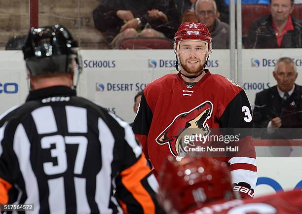 Jiri Sekac of the Arizona Coyotes talks with referee Kyle Rehman prior to a faceoff against the Edmonton Oilers at Gila River Arena on March 22, 2016...