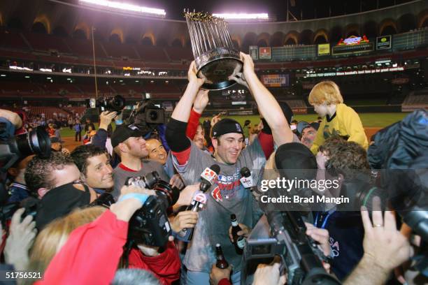 Doug Mientkiewicz of the Boston Red Sox celebrates after winning game four of the 2004 World Series against the St. Louis Cardinals at Busch Stadium...