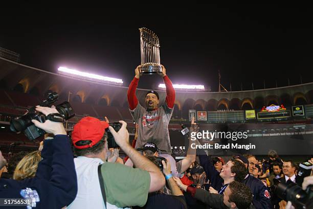 Dave Roberts of the Boston Red Sox celebrates after winning game four of the 2004 World Series against the St. Louis Cardinals at Busch Stadium on...