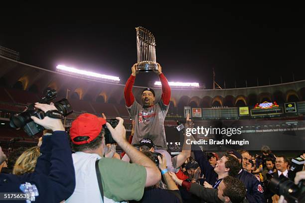 Dave Roberts of the Boston Red Sox celebrates after winning game four of the 2004 World Series against the St. Louis Cardinals at Busch Stadium on...