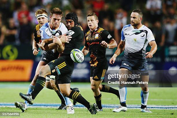 Charlie Ngatai of the Chiefs tackles Dane Haylett-Petty of the Force during the round five Super Rugby match between the Chiefs and the Western Force...