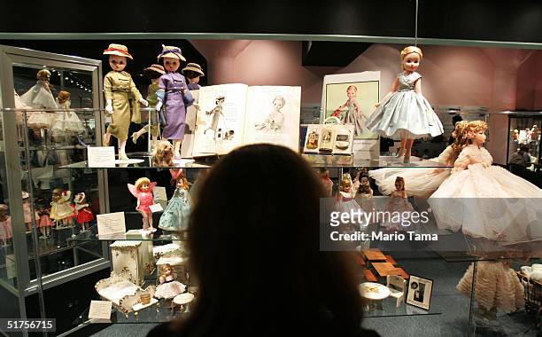 Visitors view historic handmade dolls on display at The Alexander Doll Company November 17, 2004 in New York City. The company was founded in 1923...