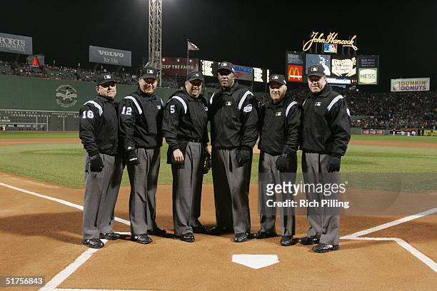 Umpires pose for a group portrait prior to game two of the 2004 World Series against the St. Louis Cardinals and Boston Red Sox at Fenway Park on...