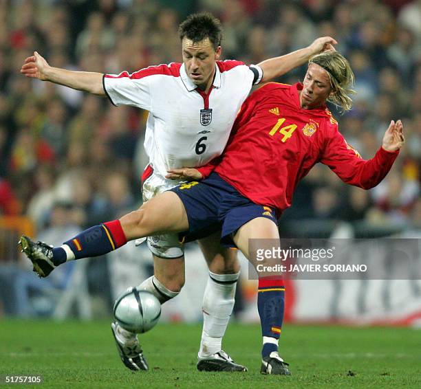 Spain's Jose Maria Gutierrez vies with England's John Terry during their football friendly international match at Santiago Bernabeu stadium in...