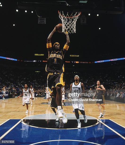 Stephen Jackson of the Indiana Pacers goes for a dunk during the game against the Minnesota Timberwolves at Target Center on November 9, 2004 in...