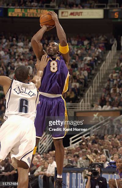 Kobe Bryant of the Los Angeles Lakers shoots a jumper against Howard Eisley the Utah Jazz during the game at Delta Center on November 3, 2004 in Salt...