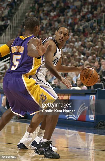 Tierre Brown of the Los Angeles Lakers tries to play defense on Howard Eisley of the Utah Jazz during the game at the Delta Center on November 3,...