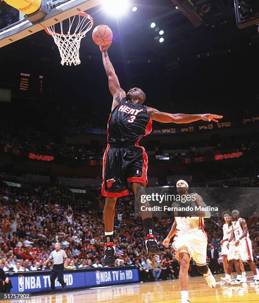 Dwyane Wade of the Miami Heat shoots during the game against the Cleveland Cavaliers at American Airlines Arena on November 4, 2004 in Miami,...