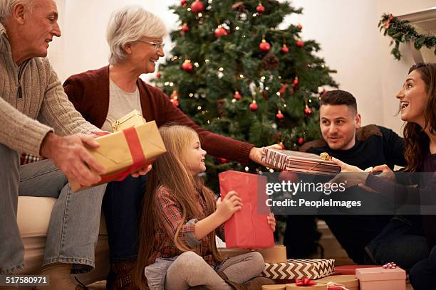 family moments at christmastime - peopleimages stock pictures, royalty-free photos & images