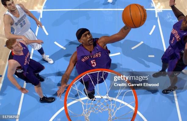 Jalen Rose of the Toronto Raptors goes to the basket against the Denver Nuggets on November 17, 2004 at Pepsi Center in Denver, Colorado. NOTE TO...