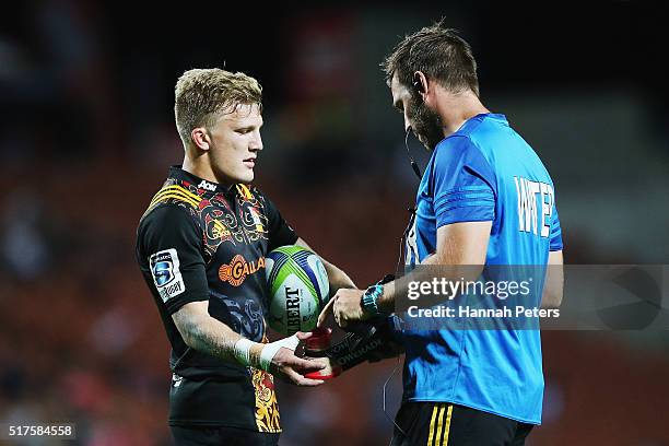 Damian McKenzie of the Chiefs collects his kicking tee during the round five Super Rugby match between the Chiefs and the Western Force at FMG...
