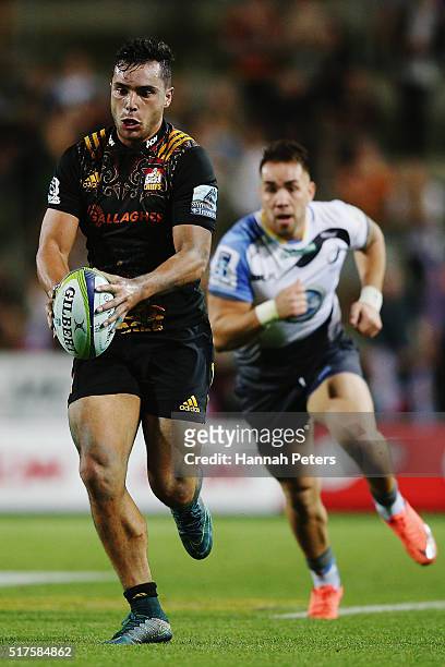 James Lowe of the Chiefs makes a break during the round five Super Rugby match between the Chiefs and the Western Force at FMG Stadium on March 26,...