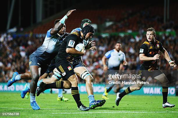 Charlie Ngatai of the Chiefs charges over to score his second try during the round five Super Rugby match between the Chiefs and the Western Force at...