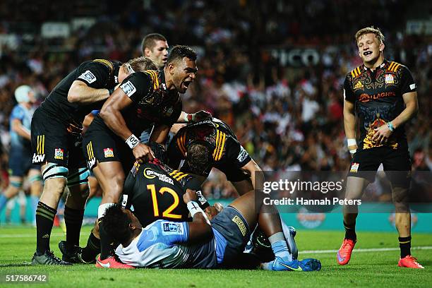 Charlie Ngatai of the Chiefs celebrates with Seta Tamanivalu of the Chiefs and his team after scoring a try during the round five Super Rugby match...