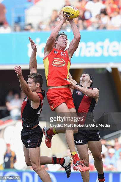 Tom Lynch of the Suns marks during the round one AFL match between the Gold Coast Suns and the Essendon Bombers at Metricon Stadium on March 26, 2016...