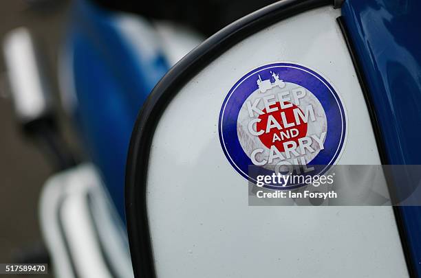 Close up of an illustration reading 'keep calm and carry oil' on a scooter as it seen parked on a street in Whitby, as enthusiasts from all over the...