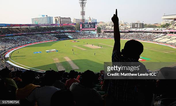 Young cricket supporter watches on during the ICC World Twenty20 India 2016 match between Bangladesh and New Zealand at Eden Gardens on March 26,...