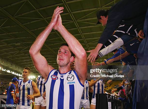 Todd Goldstein of the Kangaroos celebrates the win with fans during the round one AFL match between the North Melbourne Kangaroos and the Adelaide...