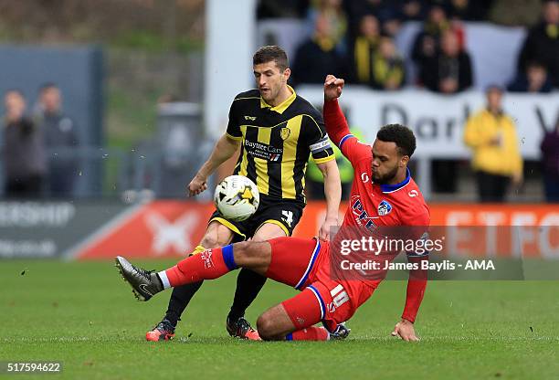John Mousinho of Burton Albion and Aaron Armadi-Holloway of Oldham Athletic in action during the Sky Bet League One match between Burton Albion and...