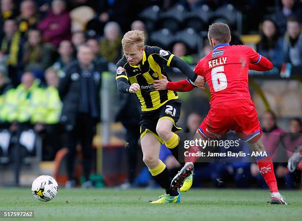 Mark Duffy of Burton Albion and Liam Kelly of Oldham Athletic during the Sky Bet League One match between Burton Albion and Oldham Athletic at...