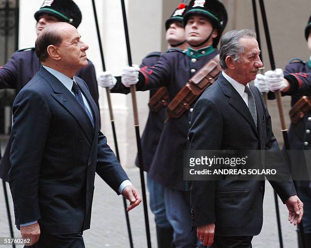 Italian Prime Minister Silvio Berlusconi greets Cyprus President Tassos Papadopoulos before their meeting at Chigi palace in Rome, 18 Novembre 2004....