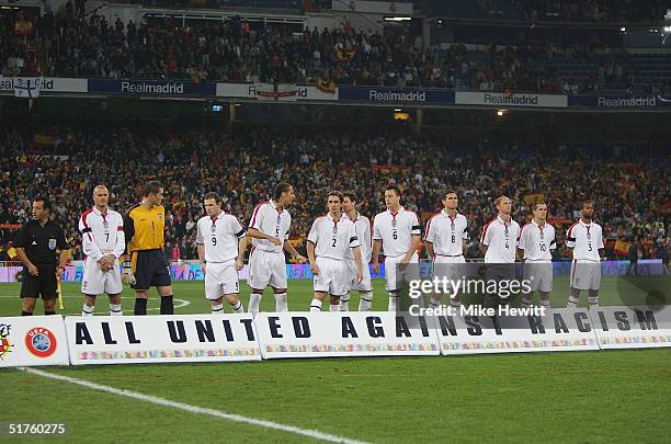 England line up for the national anthem in front of anti -racism banner during the international friendly match between Spain and England on November...