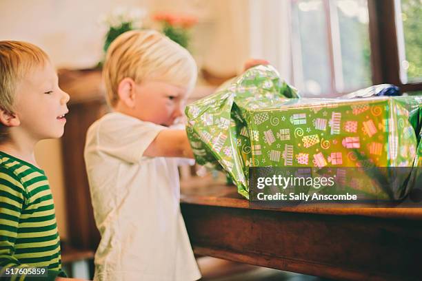 child opening a birthday present - open day two bildbanksfoton och bilder