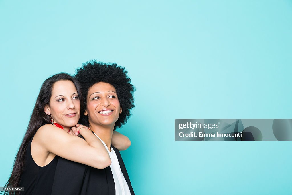 Portrait of couple of happy young women
