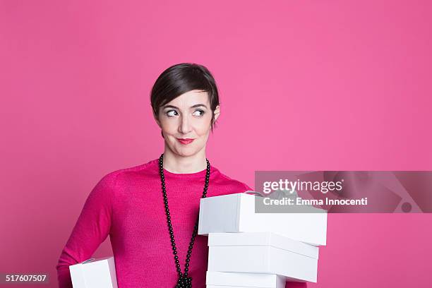 sale assistant with shoes boxes - shoe boxes stock pictures, royalty-free photos & images