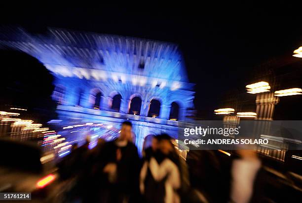 People gather in front of Rome's ancient Coliseum for a free concert performed by artists like Italian Carmen Consoli, British group The Cure and...