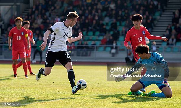 Cedric Teuchert of Germany shoots against Bumkeun Song of South Korea during the international friendly match between Germany and South Korea on...