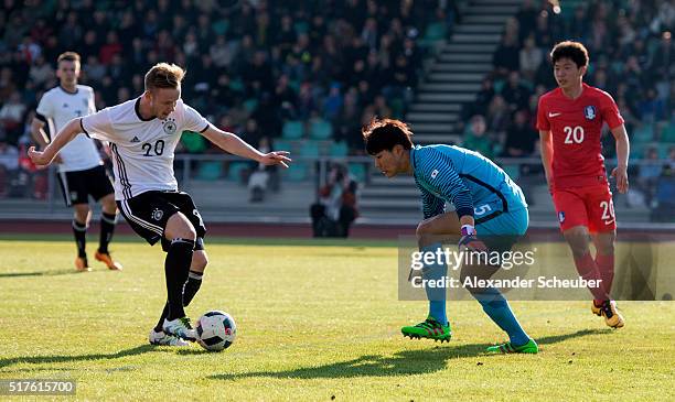Cedric Teuchert of Germany scores the second goal for his team against Bumkeun Song of South Korea during the international friendly match between...