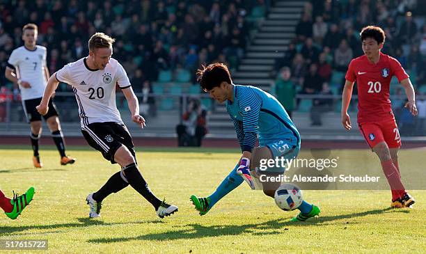 Cedric Teuchert of Germany scores the second goal for his team against Bumkeun Song of South Korea during the international friendly match between...