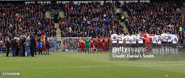 Bradford City AFC and Millwall FC stand in a minutes silence in respect of the victims of the Belguim terror attacks during the Sky Bet League One...