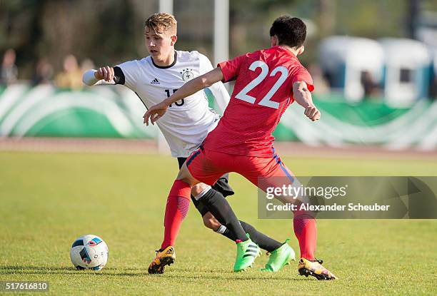 Lukas Boeder of Germany challenges Seungmo Lee of South Korea during the international friendly match between Germany and South Korea on March 26,...