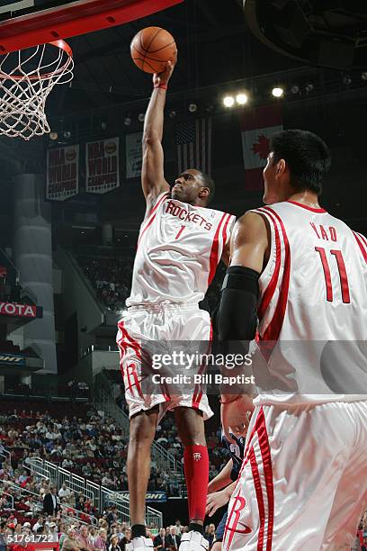 Tracy McGrady of the Houston Rockets dunks against the Memphis Grizzlies during the game on November 9, 2004 at the Toyota Center in Houston, Texas....