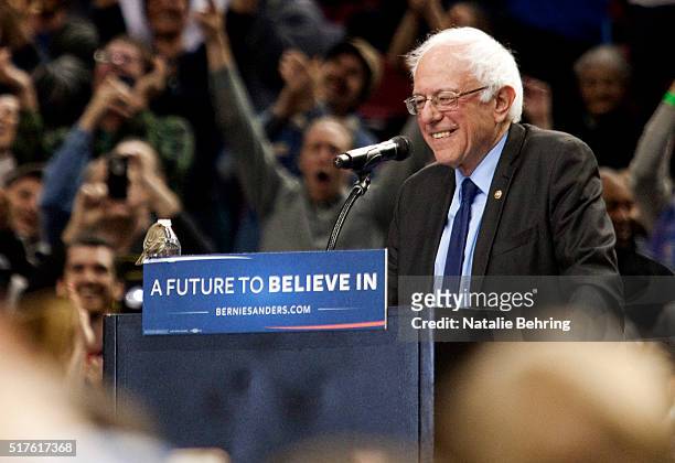 Bird lands on Democratic presidential candidate Bernie Sanders podium as he speaks on March 25, 2016 in Portland, Oregon. Sanders spoke to a crowd of...
