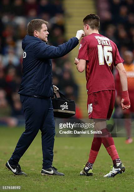Reece Burke of Bradford City AFC is escorted off the pitch by the team medic during the Sky Bet League One match between Bradford City AFC and...