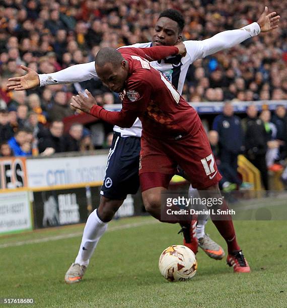 Fred Onyedinma of Millwall FC and Kyel Reid of Bradford City AFC compete for the ball during the Sky Bet League One match between Bradford City AFC...