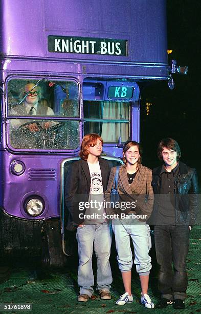 Actor Rupert Grint, Actress Emma Watson and Daniel Radcliffe pose in front of the magical purple Knight bus during the Harry Potter And The Prisoner...