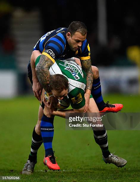 Irish fly half Greig Tonks is hauled back by Francois Hougaard of Worcester during the Aviva Premiership match between Worcester Warriors and London...