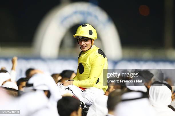 Andrea Atzeni celebrates after riding Postponed to victory in the Dubai Sheema Classic Presented By Longines as part of the Dubai World Cup at Meydan...