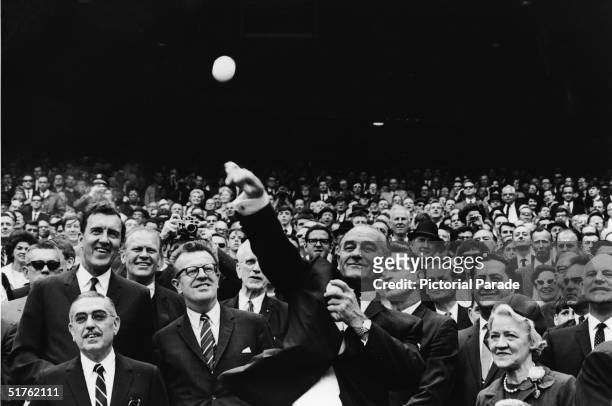 President Lyndon Baines Johnson throws out the first pitch of the 1967 baseball season at District of Columbia Stadium, Washington, DC, April 10,...