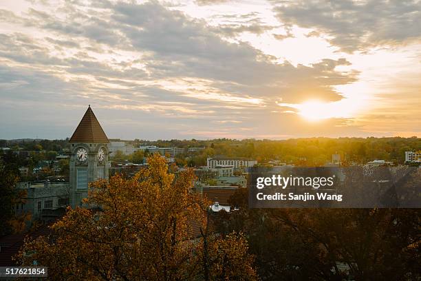 bird's-eye view of the city of bloomington, indiana and the campus of indiana university with sunset in fall - bloomington indiana stock-fotos und bilder