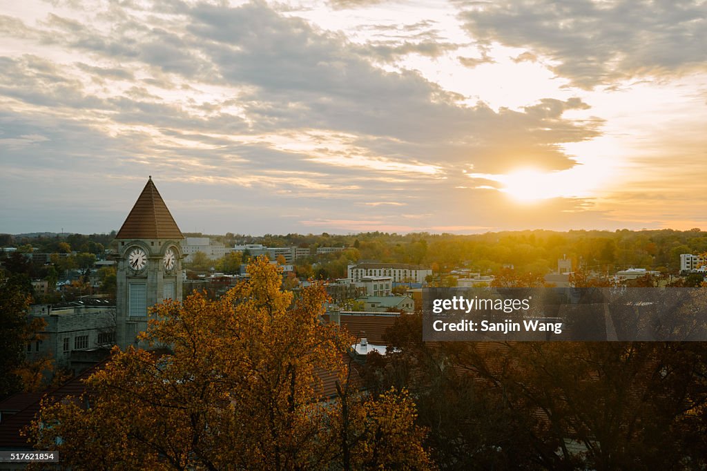 Bird's-eye view of the City of Bloomington, Indiana and the campus of Indiana University with sunset in fall
