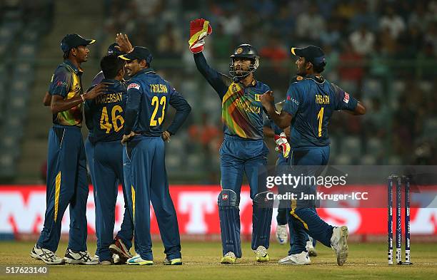 Jeffrey Vandersay of Sri Lanka celebrates the wicket of Joe Root of England with team mates during the ICC World Twenty20 India 2016 Super 10s Group...