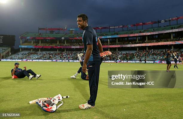 Angelo Mathews, Captain of Sri Lanka warms up ahead of the ICC World Twenty20 India 2016 Super 10s Group 1 match between England and Sri Lanka at The...