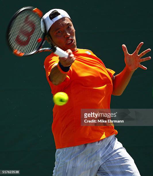 Tatsuma Ito of Japan plays a match against Gael Monfils of France during Day 6 of the Miami Open presented by Itau at Crandon Park Tennis Center on...